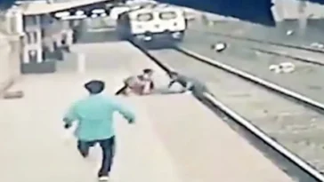 VIDEO: Heroic man saves young boy with a blind mom from oncoming train